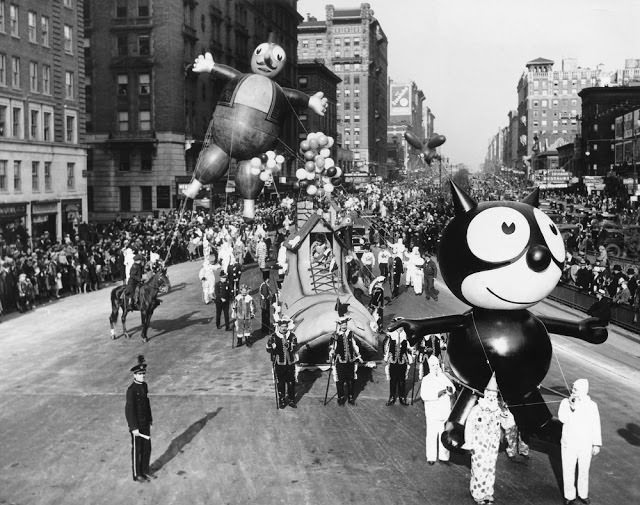 A Felix the Cat balloon and other parade floats and balloons are led down Broadway during the annual Macy’s Thanksgiving Day Parade in 1930.