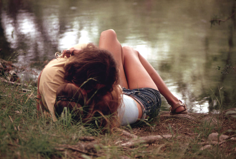 #16 A teenage couple embraces on the bank of the Frio Canyon River near Leakey, May 1973. (Marc St. Gil/NARA