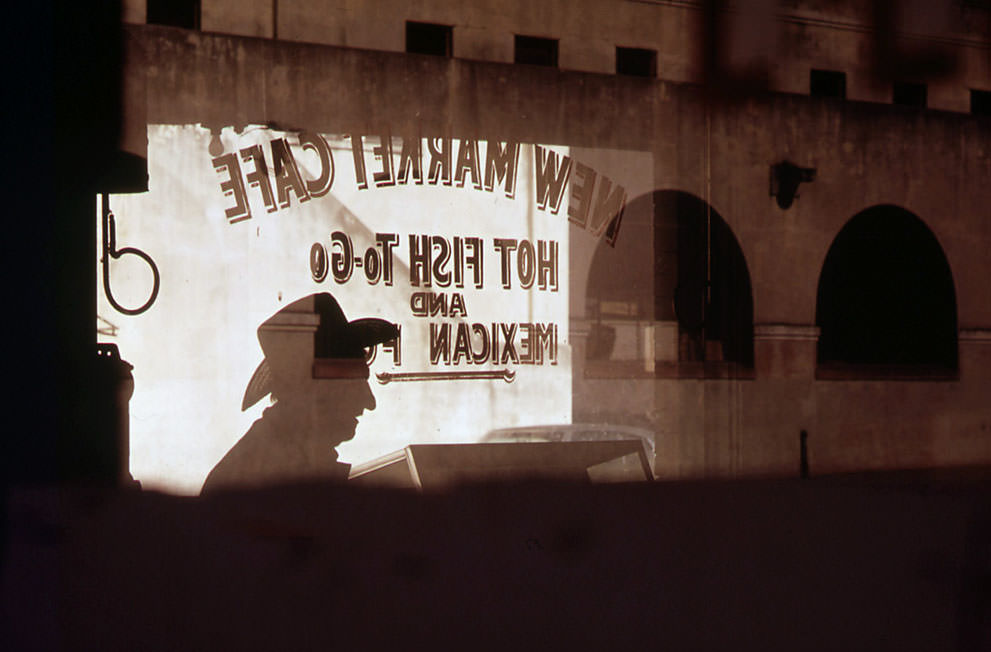 #26 Customer’s shadow reflected in window of New Market Cafe in the old Mexican market area of San Antonio, in November of 1972. (Bob Smith/NARA)