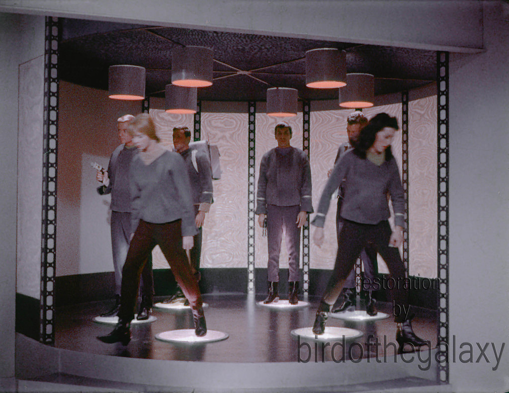 #27 In this shot, Number One and Yeoman Colt both are symmetrically stepping off the transporter platform.