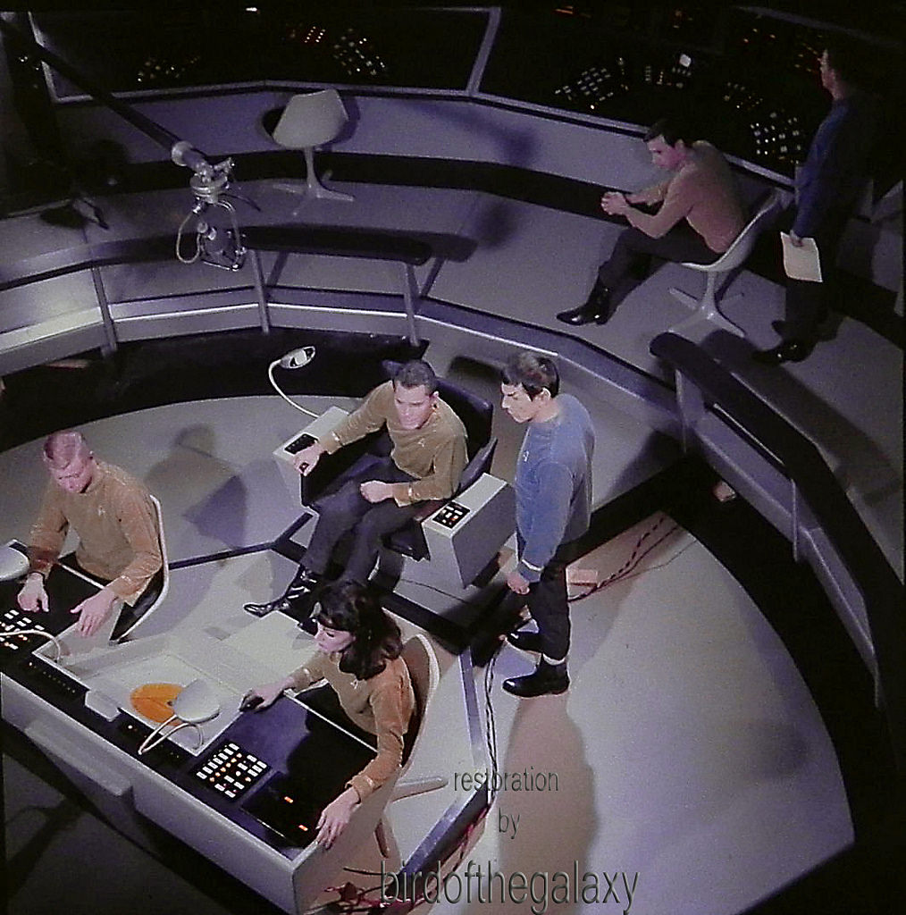 #6 Majel Barrett, Leonard Nimoy, and Jeffrey Hunter are visible in the shot, but in addition one can see both a sound boom and wires that presumably carry the power that is illuminating a number of the controls at the helm and weapons stations.
