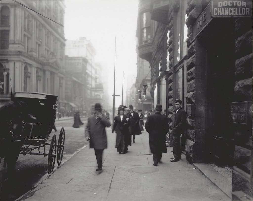#52 Pedestrians on the sidewalk near the intersection of Sixth and Locust Streets, ca. 1900s