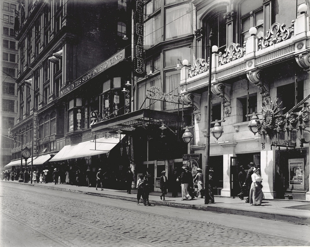 #53 Pedestrians passing the F.W. Woolworth Company store at 413 N. Sixth Street and the Strand Theater box office, 1914