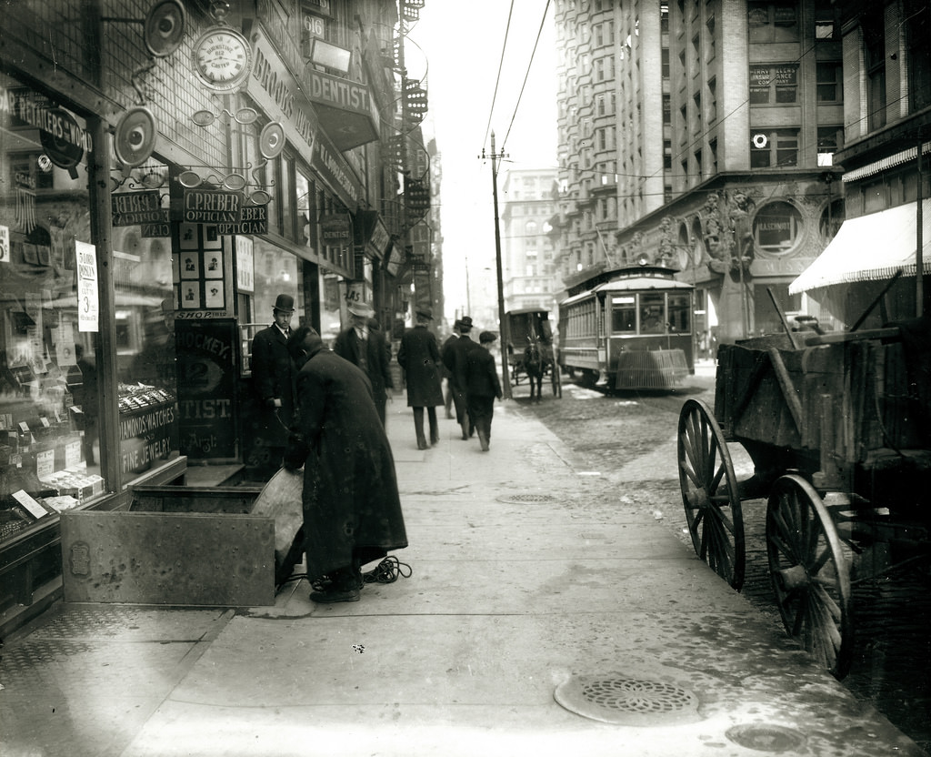 #23 Sidewalk on Olive Street looking west from Seventh Street, ca. 1900s