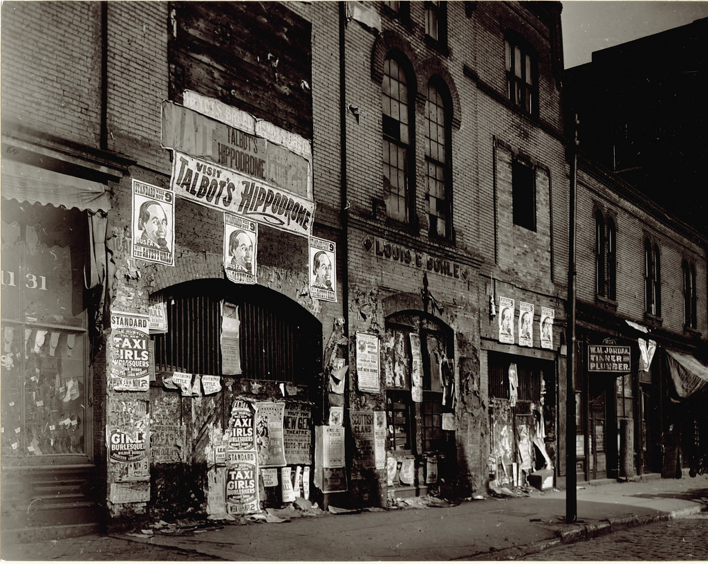 #64 Talbot’s Hippodrome posters posted on buildings at 1123 – 1131 Market Street, ca. 1900s