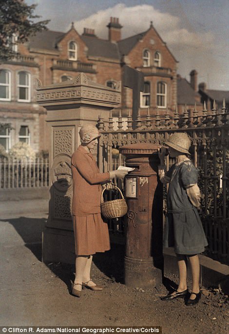 #16 Two girls send a letter at a red pillar box in Belfast in 1927
