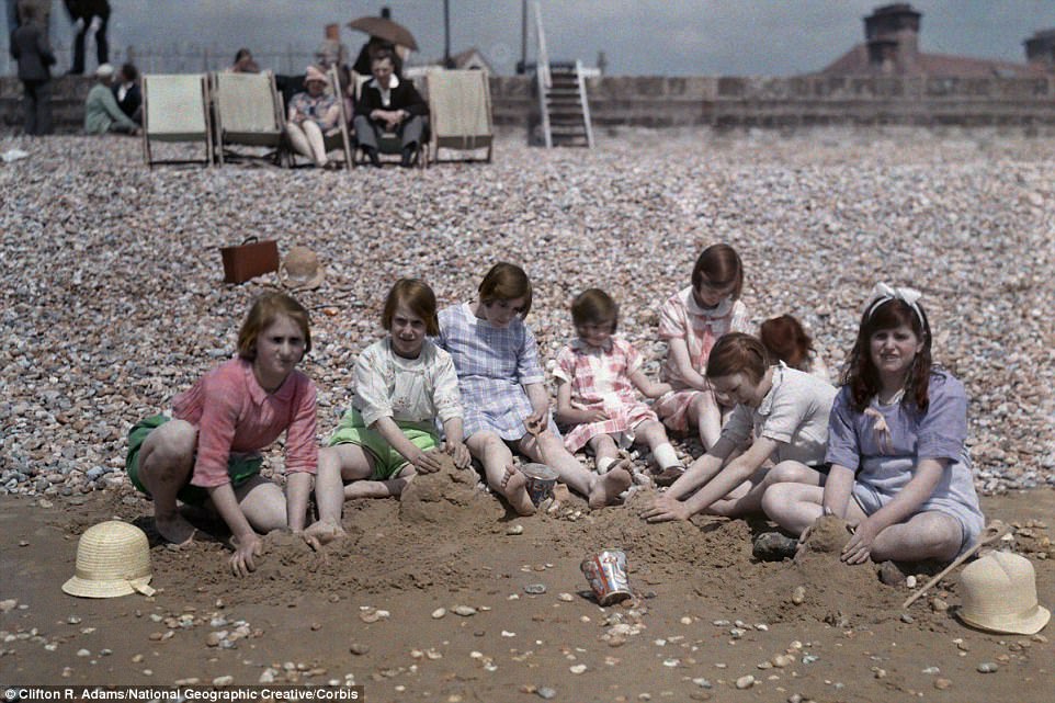 #4 A group of children sit, playing in the sand in 1931 at Dymchurch beach in Kent, which lies south-west of Folkestone