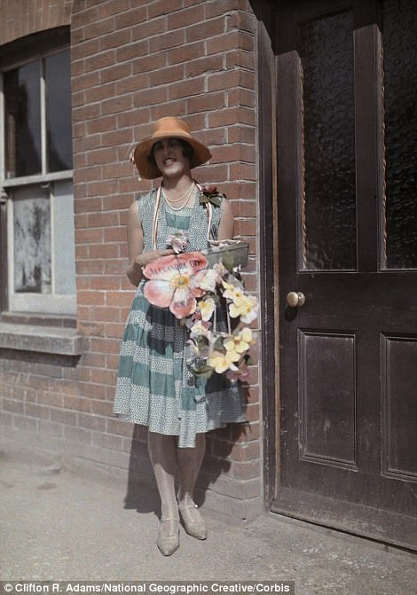 #35 A woman sells artificial flowers for charity on Alexandra Day in Kent