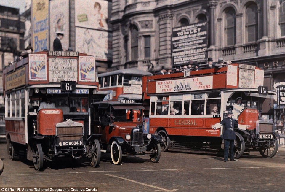 #43 A policeman directs buses at the intersection of Trafalgar Square in the centre of London in 1929