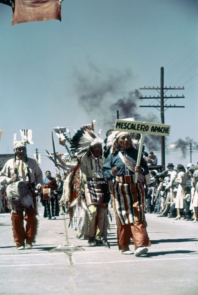 #20 Members of the Mescalero Apache tribe participate in the parade.
