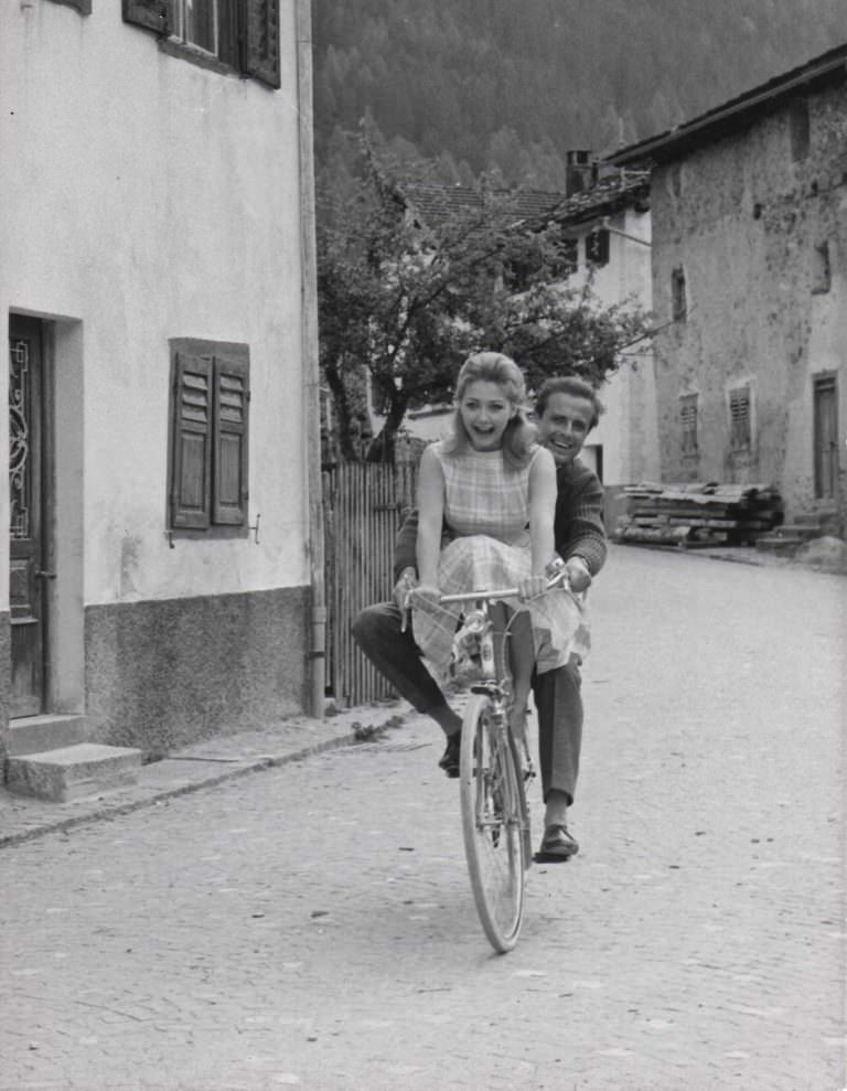 #4 Christine Kaufmann and Joachim Hansen riding a bike.