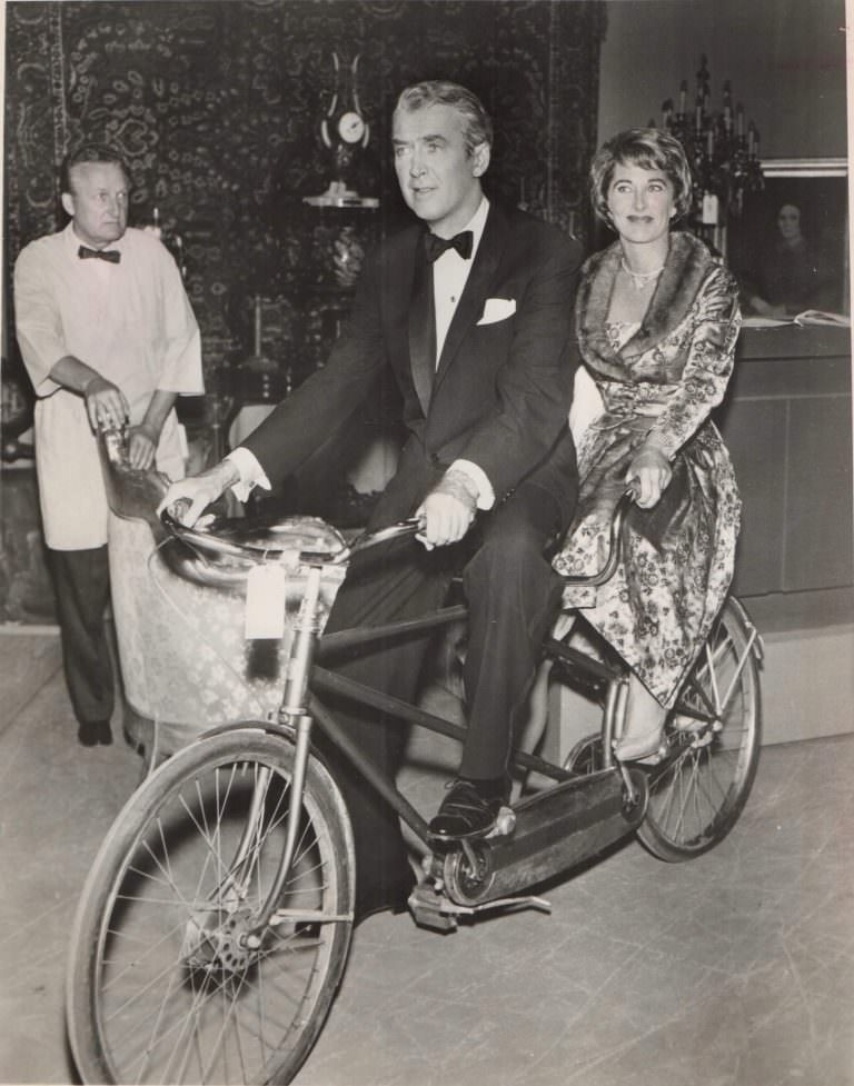 #10 James and Gloria Stewart riding a bike.