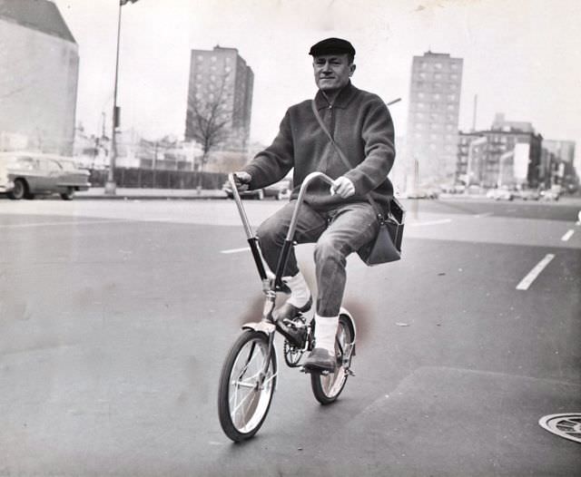 #17 E.G. Marshall riding a bike, 1962