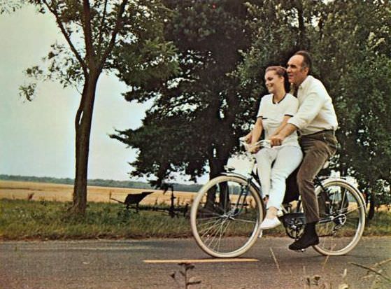 #18 Romy Schneider and Michel Piccoli ride a bike, 1970