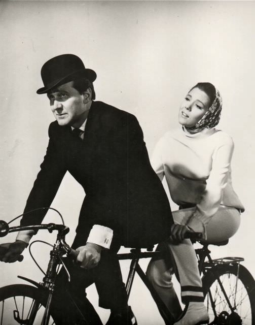 #27 Patrick Macnee and Diana Rigg riding a bike