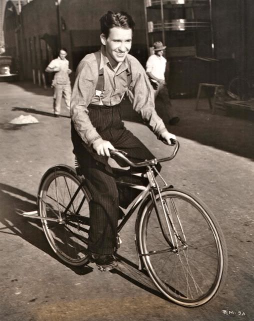 #31 Burgess Meredith riding a bike, 1951