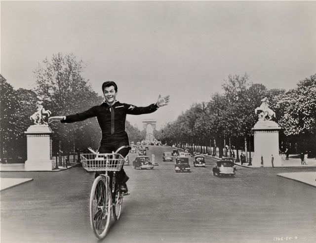 #45 Tony “Look Ma No Hands” Curtis riding a bike.