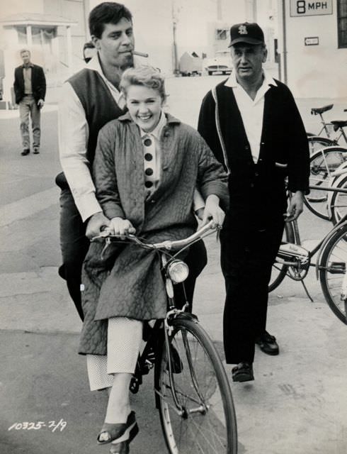 #49 Jerry Lewis and Connie Stevens ride a bike.