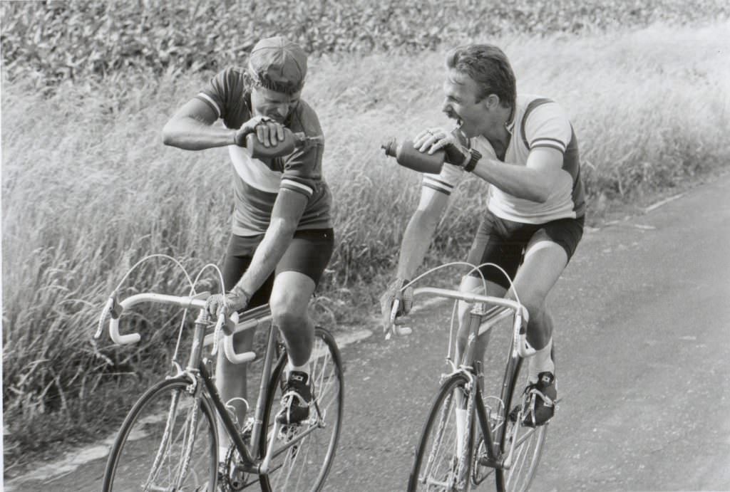 #8 David Marshall Grant and Kevin Costner riding bikes.