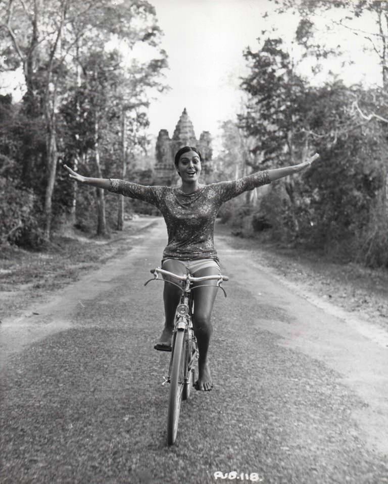 #14 Daliah Lavi riding a bike.