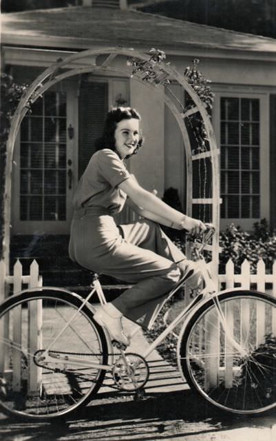 #29 Deanna Durbin riding a bike
