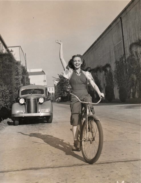 #1 Joan Leslie riding a bike