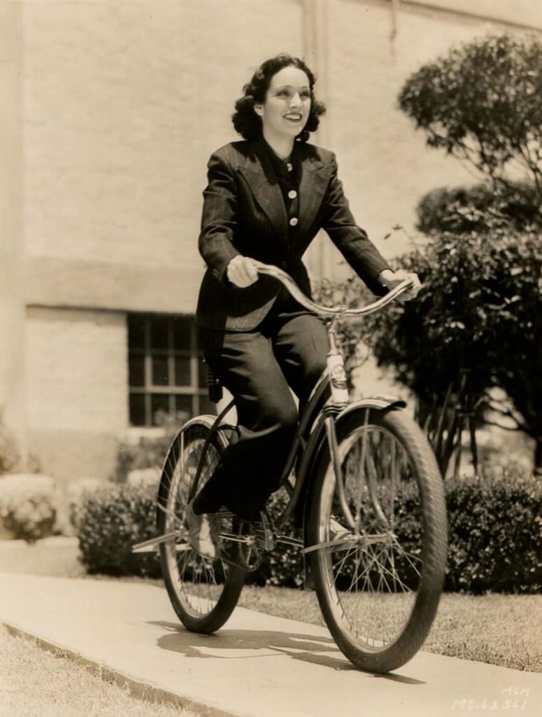 #55 Priscilla Lawson riding a bike.