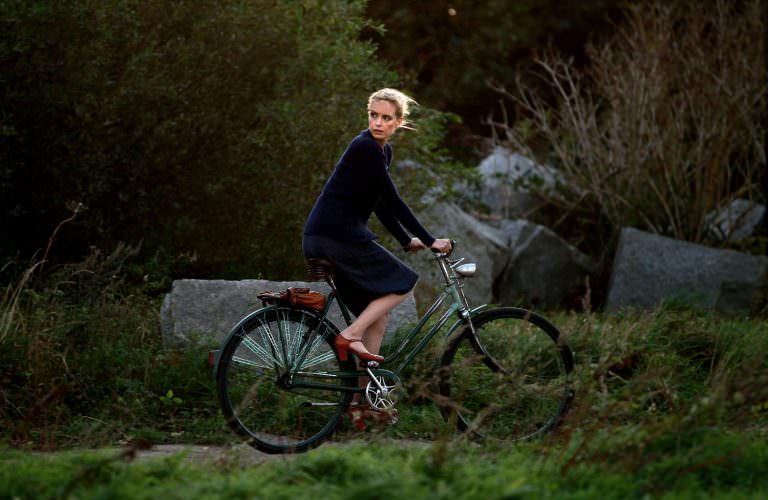 #59 Nina Hoss riding a bike.