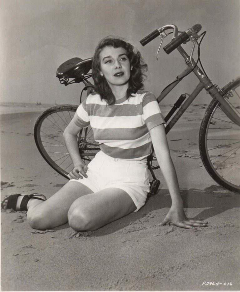 #16 Deanna Durbin rides a bike. Colorfully.