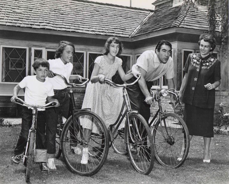 #18 Anthony Quinn and kids on their bikes.