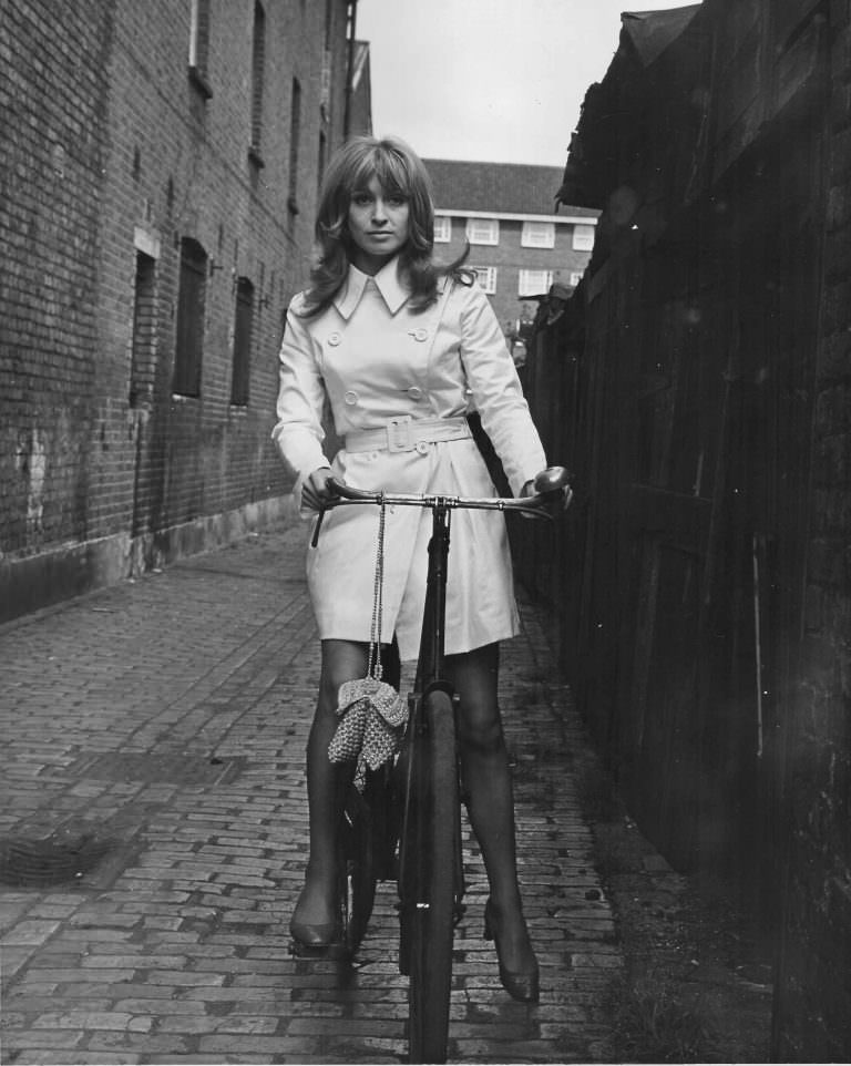 #28 Suzy Kendall on a bike.