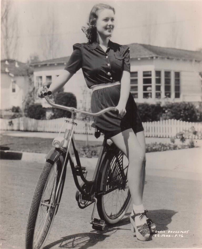 #32 Doris Davenport models a bike.