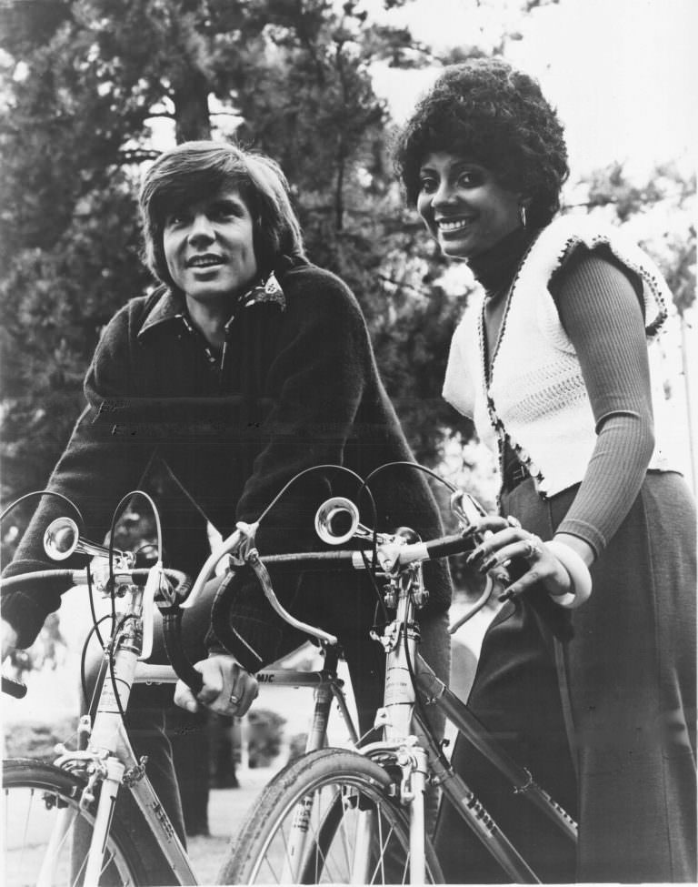 #38 John Davidson and Leslie Uggams riding bikes.