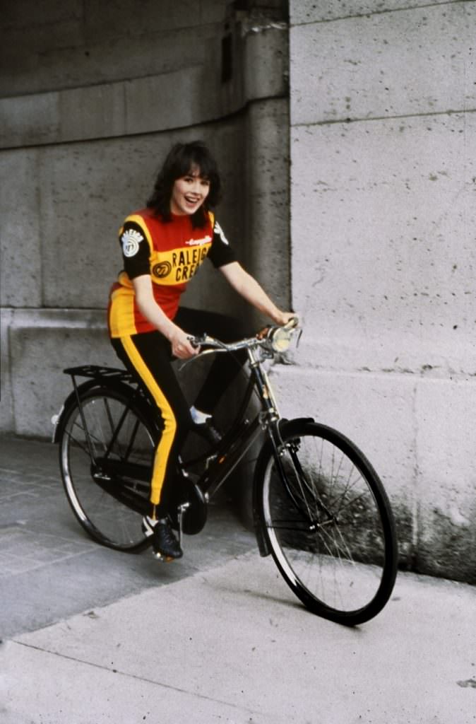 #40 Isabelle Adjani on a bike.