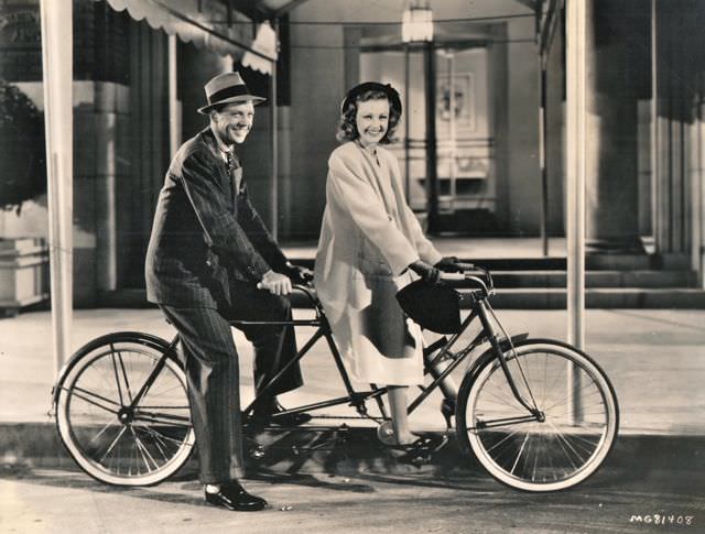 #52 Dan Dailey and Virginia Grey ride on their bikes.