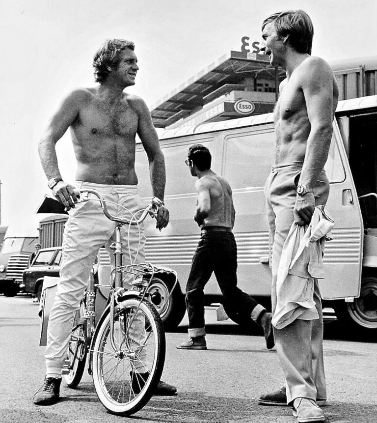 #7 Steve McQueen on a bike, shirtlessly.