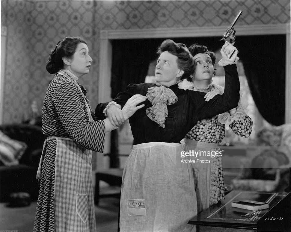 #54 Marjorie Main Zasu Pitts and Aline MacMahon restrain Marjorie Main in a scene from the film Tish (1942)