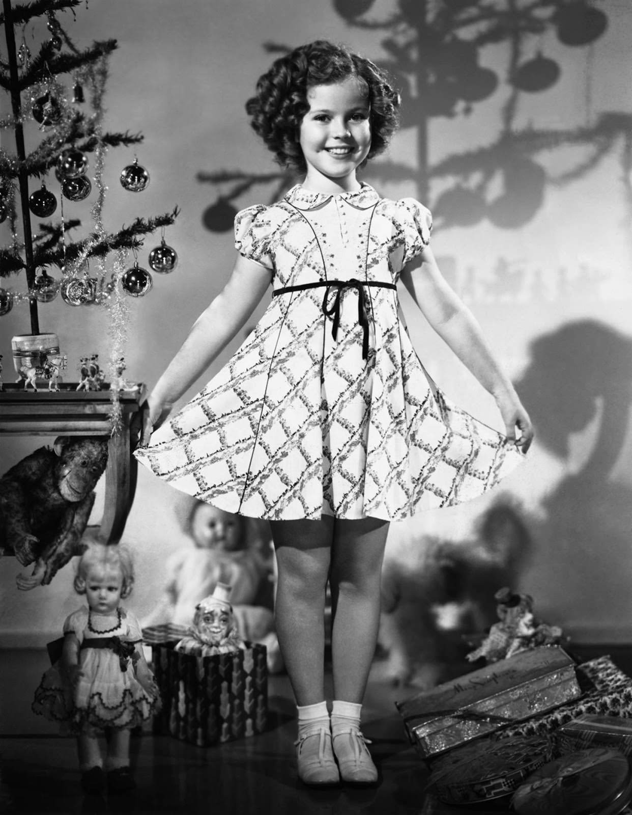 #73 Shirley Temple modeled a new Christmas dress in 1935.