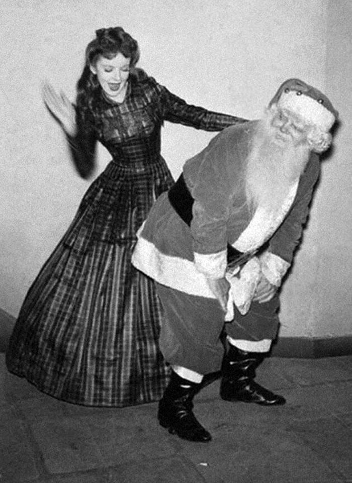 #76 Ida Lupino, a Warner Brothers star, spanks Saint Nick, 1942.