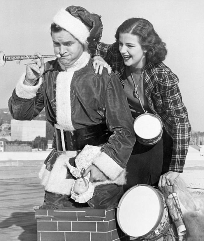 #46 Bob Hope is seen with actress Helen Wood in this 1938 gagshot of him climbing out of a chimney.