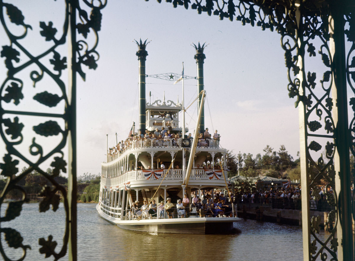 #12 A crowded Mark Twain Riverboat sails at Disneyland in July 1955