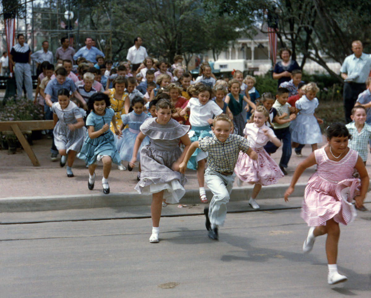 #21 Children run into Disneyland on opening day, July 17, 1955