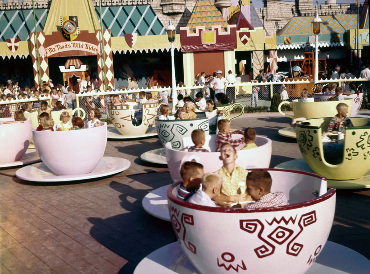 #6 Visitors ride the Mad Hatter’s Tea Party attraction in Fantasyland on July 17, 1955