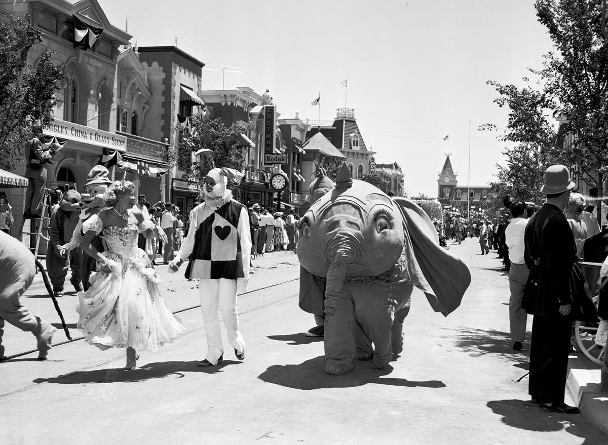 #10 Dumbo and other characters from Disney movies appear in a parade down Main Street, U.S.A., at the Disneyland opening on July 17, 1955