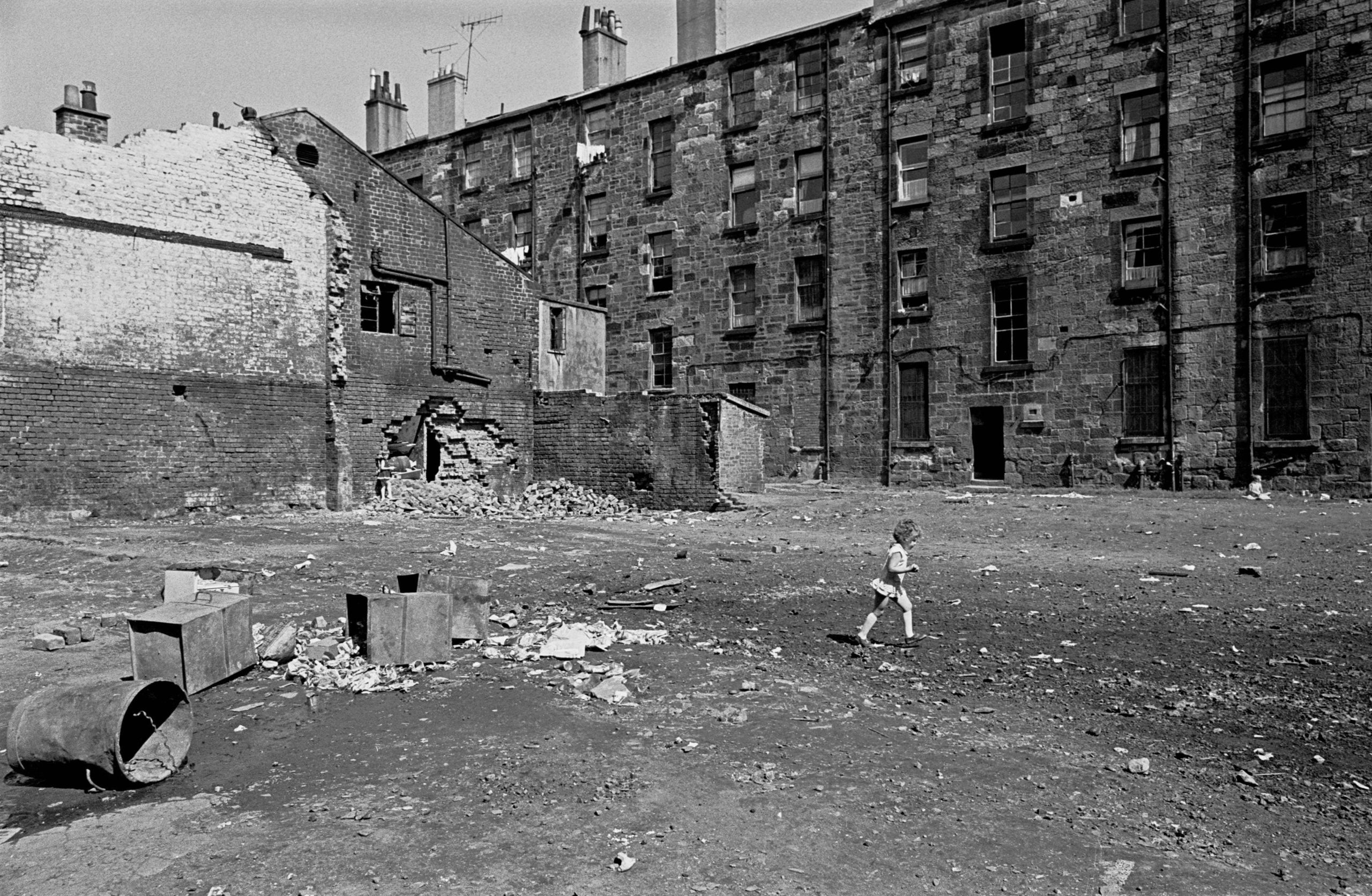#20 Child crosses a Glasgow tenement courtyard 197
