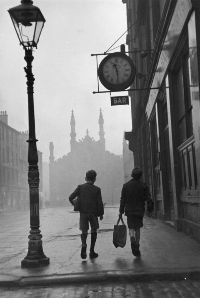 #9 Two boys walking along a street in the run-down Gorbals