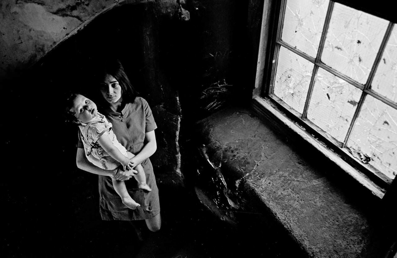 #48 Mother and her baby on the staircase of her condemned Gorbals tenement 1970