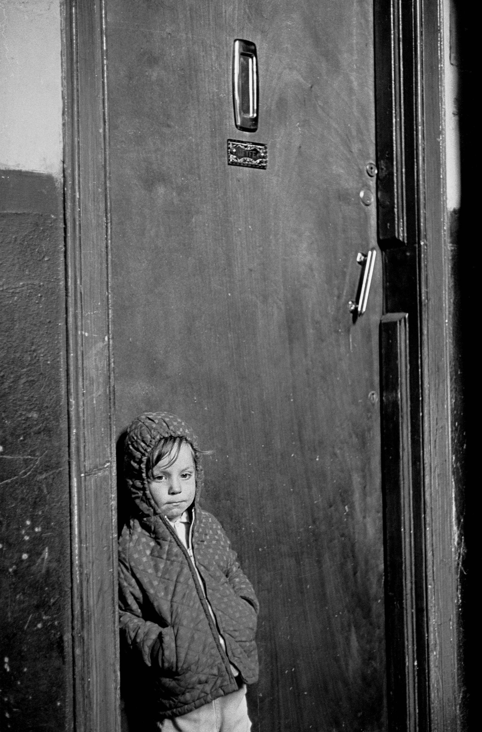 #19 Child waiting for his parents to come home Glasgow tenement 1971