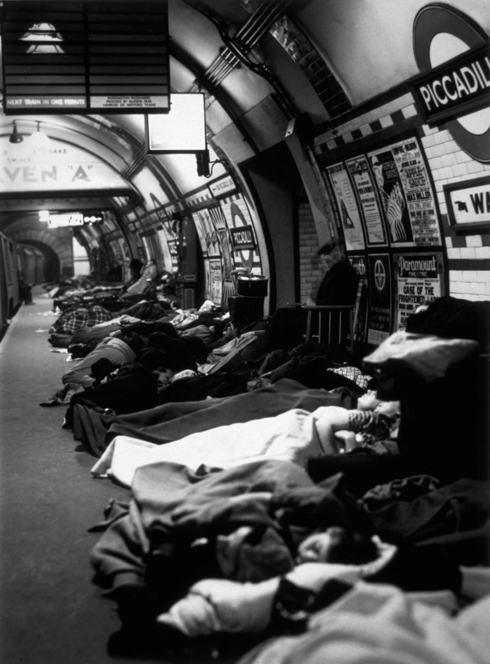 #50 People asleep on the platform at Piccadilly Tube Station, London during an air raid, 1940.