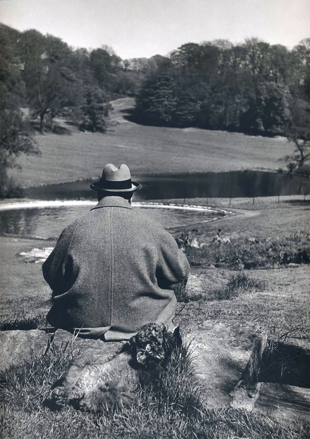 #25 British Prime Minister Winston Churchill with his poodle, Rufus, in the gardens of his Chartwell estate, 1951.